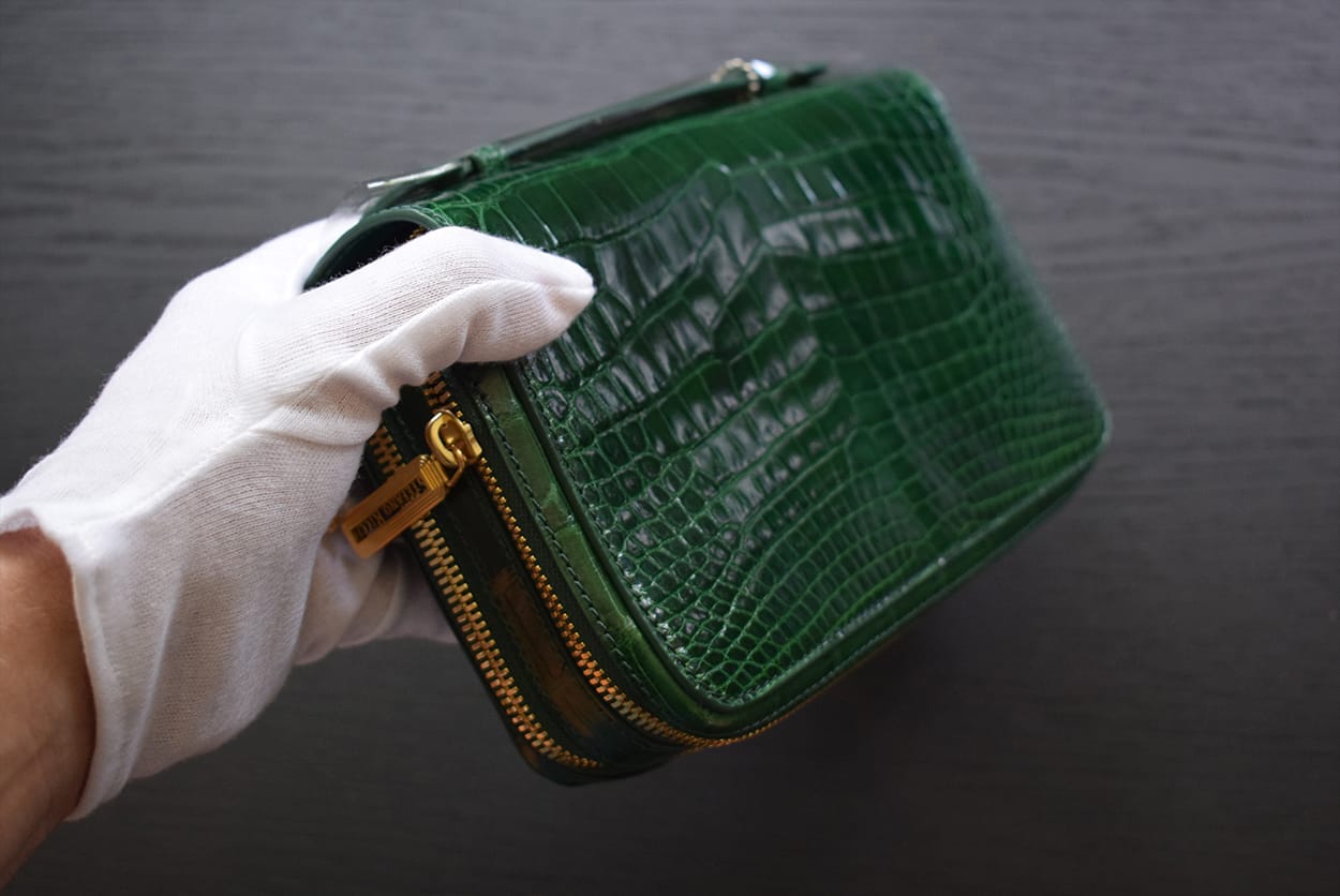 green crocodile pouch