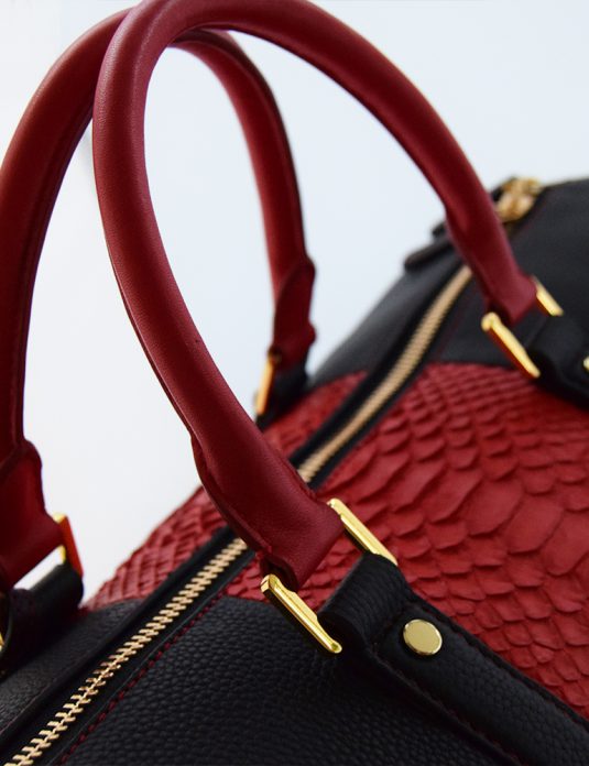 Togo with red python duffle bag